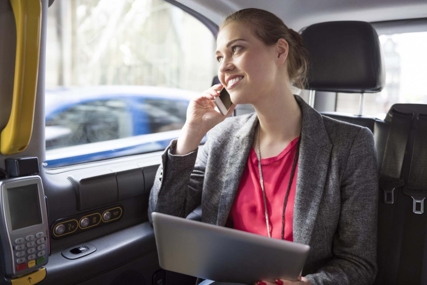 businesswoman-working-while-drive-a-taxi-2021-08-26-20-15-37-utc